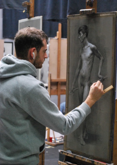 Advanced Sculpture Program student Gabriel Schwaab working on a charcoal drawing from life