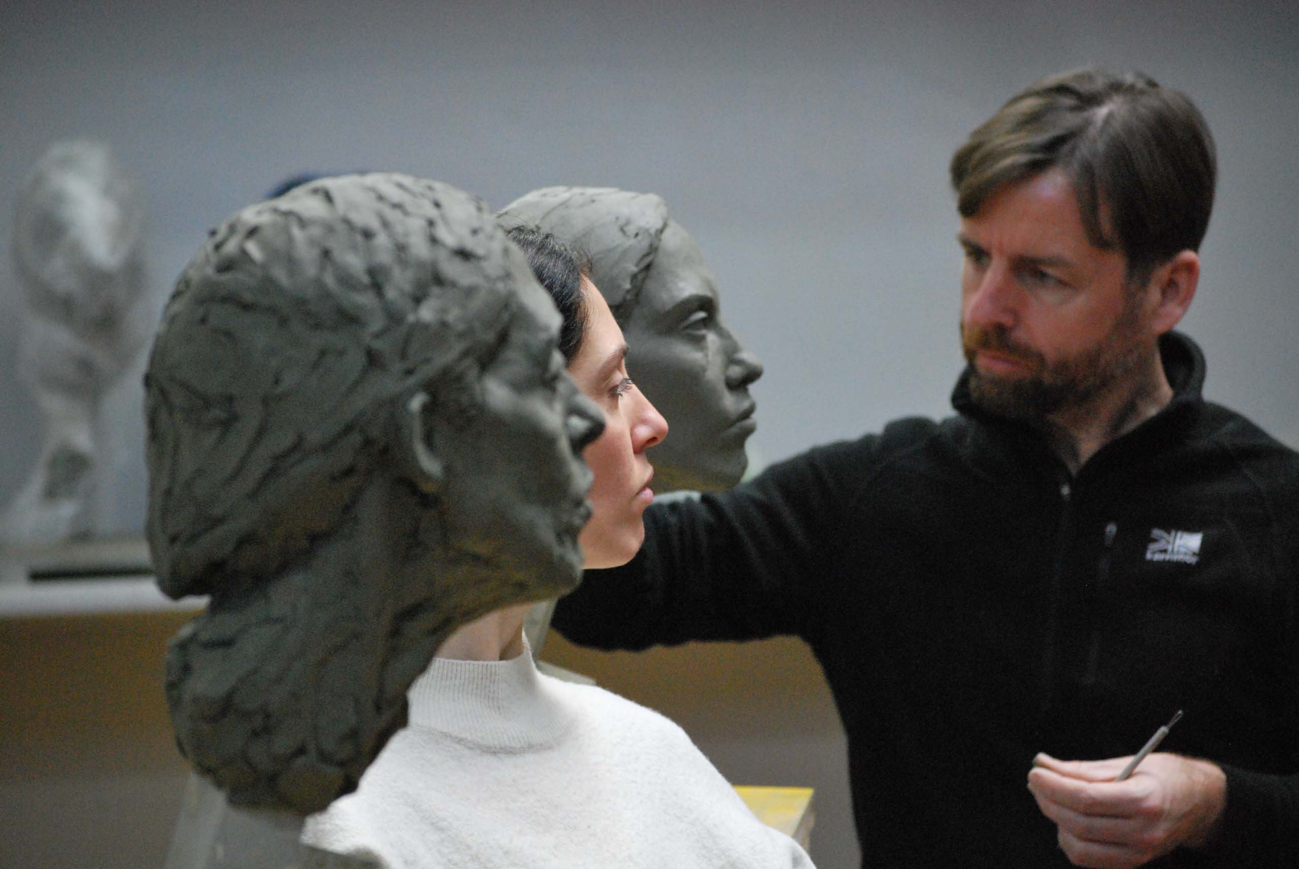 Advanced Sculpture Program Student, Daniel Russell, working on a clay portrait from life at The Florence Academy of Art