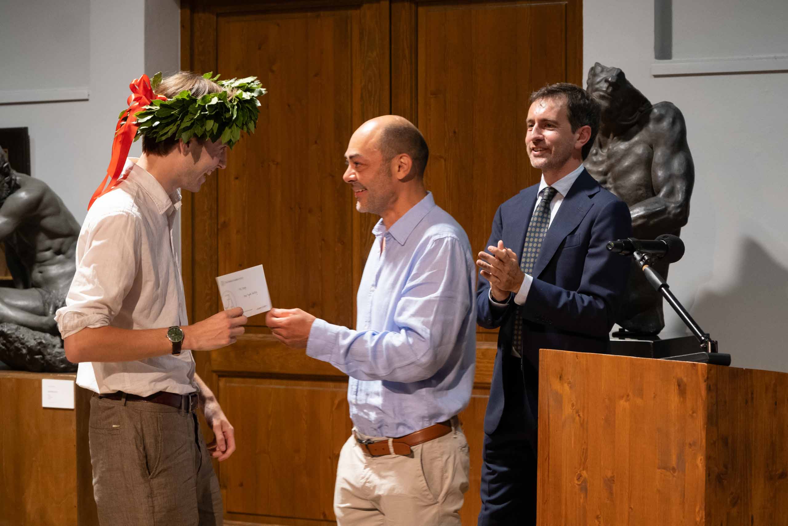 Finn Knapp receives an award for best Figure Painting of the Advanced Painting Program from Program Director, Ramiro Sanchez