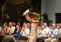 Caitlin Bludgus recieves their diploma Caitlin Bludgus recieves their diploma