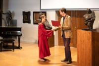 Laura Bohon receives the diploma